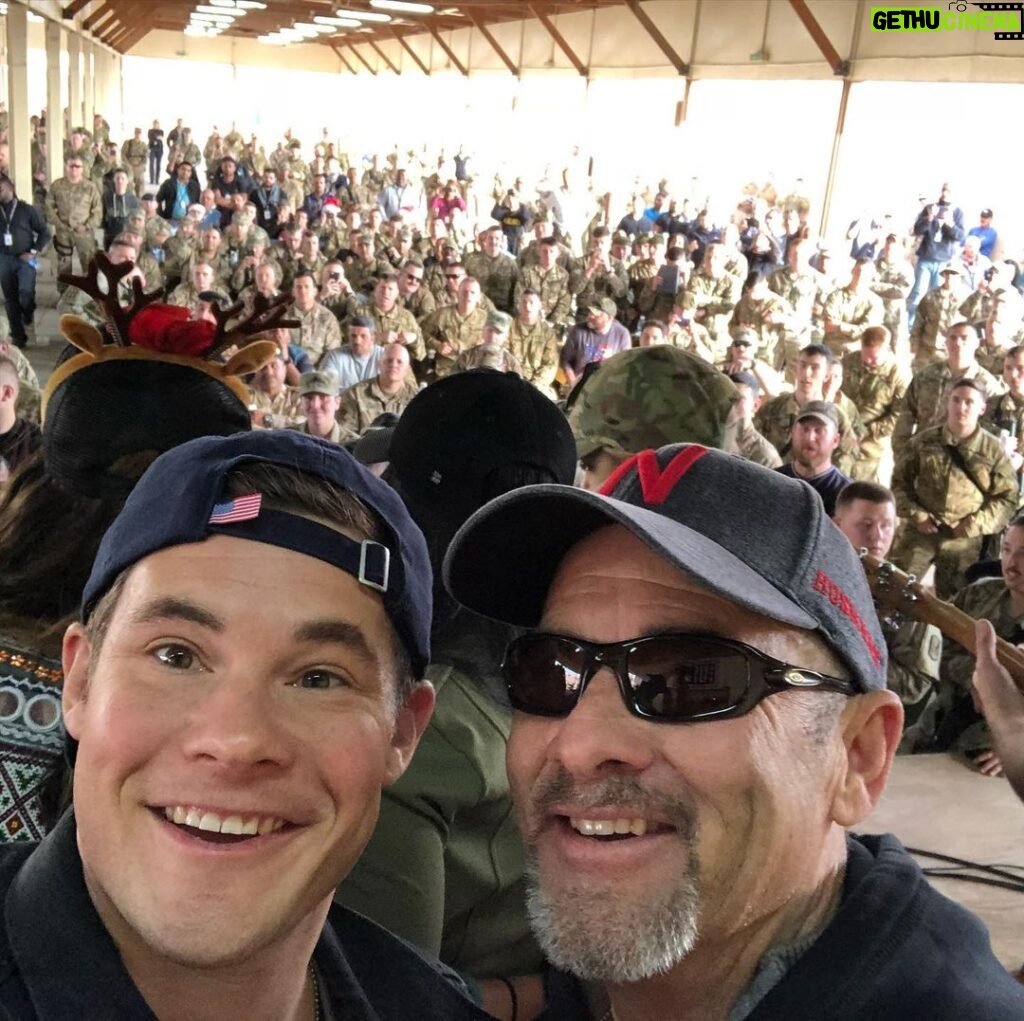 Adam Devine Instagram - HAPPY FATHERS DAY! here’s a pic of me and my pops in Iraq on Christmas Day on a @USO tour. We’ve done a lot of cool things together and been on plenty of adventures but this one was a favorite. You are my sounding board, my confidant, my best friend, my rock. I love you Dad. My dad was diagnosed with Lung Cancer in April and to say it has put myself and our family in a tail spin would be a gross understatement. Hug your fathers and tell them you love them and if they’re happy and healthy count you blessings. Camp Taji Airbase