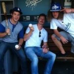 Adam Devine Instagram - Let’s go DODGERS! I’ve got to do some cool stuff with the @dodgers over the years. The first pic is me singing the national anthem while starting into the soul of America and the second pic is me and the Dew’d crew kicking it in the dugout post getting into a fist fight over who got to throw the first pic. Big congrats to the World Champs the Los Angeles @dodgers !!!