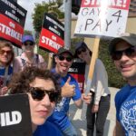Adam Devine Instagram - I asked for a sign and they said “we have the perfect sign for you”. THEY WERE RIGHT! It’s important that the gays and non gay WGA writers get paid!!!
