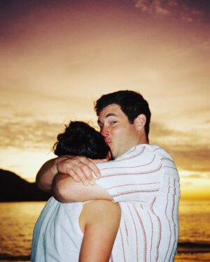 Adam Devine Instagram - Obviously, Cancer SUCKS. The absolute worst. Join me and #StandUpToCancer as we #kisscancergoodbye I know it’s a cute AF campaign and this photo of me kissing my wife is top notch cute but let’s quit staring at the kauuute pic and donate at @su2c. Lets KISS CANCER GOODBYE!