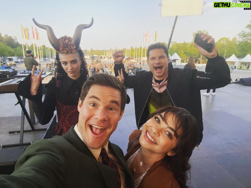 Adam Devine Instagram - Wow. What an absolute phenomenal response to Bumper In Berlin! Thank you so much to everyone who is watching and enjoying our weird little show. Thank you to @peacocktv for letting us do it ! Thanks to @elizabethbanks for birthing this weird lil baby and THANK YOU to our incredible showrunner @meganamram for teaching this baby how to walk and say it’s first words (pee pee- poo poo). The homies @straussschulson @richiekeen & @maureenbharoocha directed the show and made it infinitely more beautiful than a bumper spin off show has any right to be. Thank you to the incredible cast. You guys crushed beyond expectations and lastly, THANK YOU to the fans who gave this show a shot. So happy that I get to call this my job and it’s all because of you. Thanks a billion. 🍻