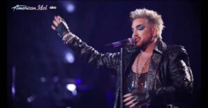 Adam Lambert Instagram - LOVED singing I CANT STAND THE RAIN on @americanidol tonight! (From my album High Drama) still smiling at the nostalgic appearance of the cape @katyperry surprised me by wearing back on my season. ❤️ Big thanks to @timstewart, Pooley, @peterkeys88 and the rest of the band for slaaaaaying.
