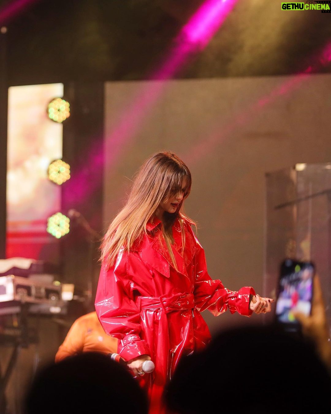 Aima Baig Instagram - A little late to post these - and yet there are still so many videos and pictures from that night in Dubai. Might be uploading those aswell 🤔 I had the best time performing for @ismmartgroupofficial Whattay malangi crowd it was 🔥❤️ P.s another clothing piece “the Red latex coat” i’m totes obsessed w 🙃🥹 Dubai, United Arab Emirates