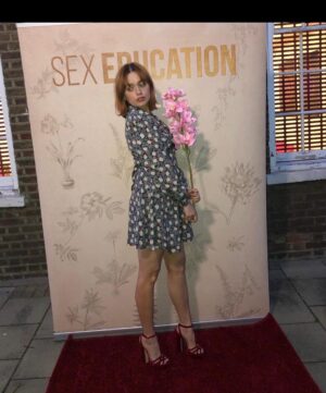 Aimee Lou Wood Instagram - @sexeducation VIRTUAL PREMIERE FEAT HERO @patrickwilson 
@emilywoodmakeup 
@emmalanestylist 
@miumiu 
@jimmychoo