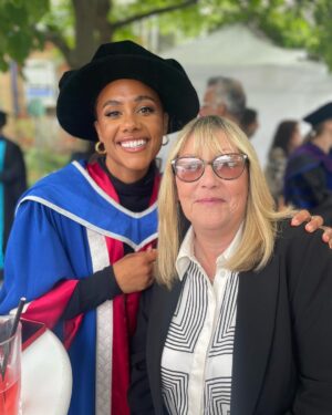 Alex Scott Instagram - Took mama to uni with me 🖤

Thank you @officialqmul for awarding me an Honorary Fellowship for invaluable contribution to the world of sport, social purpose and inclusion… what a special day.

Slide 6: my friend Sarah graduated from the university 25 years ago, I was with her Celebrating her special day, fast forward to the present she came to celebrate with me 🥰