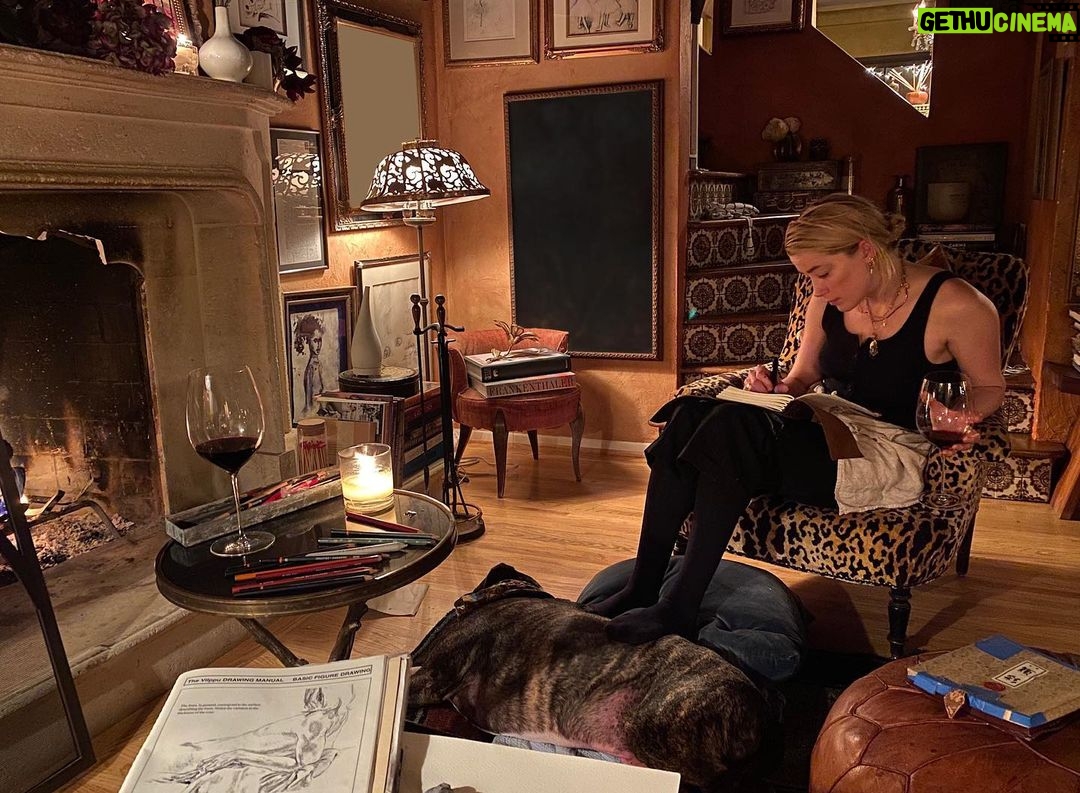 Amber Heard Instagram - Fire + wine + art (and a hella cute ottoman named Birdie) = one happy quarantine. I hope everyone finds their formula for health and sanity in these crazy times