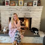 Angela Kinsey Instagram - The only thing that brings Oreo & Biscuit together… a cozy fire on a rainy morning. Photo by Josh who said I looked pretty sitting by the fire. And I said in my old robe I got at Walgreens?? 😂❤️