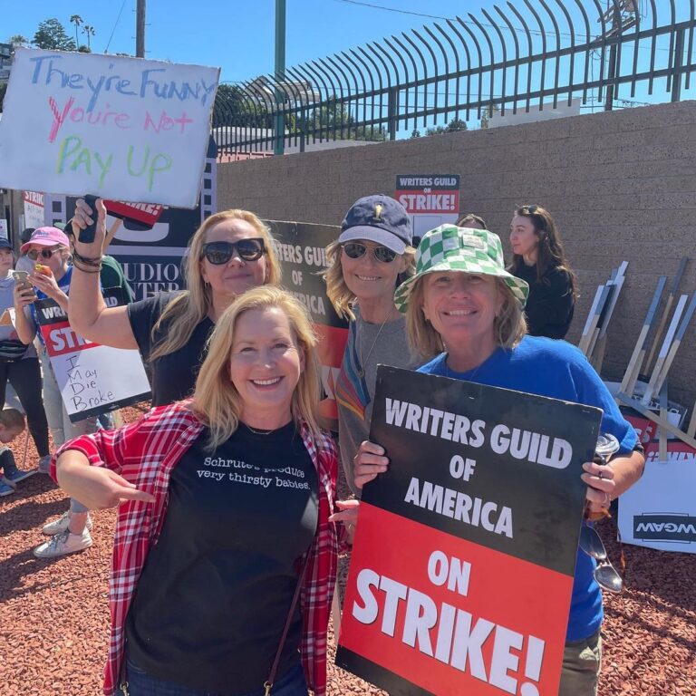 Angela Kinsey Instagram - Zoom in on my tshirt… “Schrutes produce very thirsty babies.” A great line by the amazing writers we had on The Office! Today I joined my writer friends on the picket line to show my support! ❤️ #wgastrong