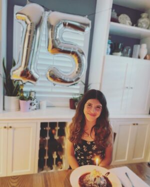 Angela Kinsey Instagram - My lil’ gal is 15 today and I’m a teary mess. I am just so proud of her and the wonderful young lady she’s becoming. I am so thankful to be her Mom! I love ya to the hope of my heart Isabel! ❤️ Slide to see some adorable sibling content… Cade made her homemade pesto for her birthday dinner and she was SO happy about it she bear hugged him. And a homemade chocolate lava cake with vanilla ice cream and sprinkles! The last picture is how I see her in my mind… just my little gal. I mean I’m tearing up now just thinking about the passage of time and am feeling so thankful. ❤️