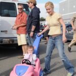 Angela Kinsey Instagram - #tbt Going on a walk with my daughter on my lunch break on the set of The Office. ❤️ (Angela Martin blouse paired with Angela Kinsey jeans & sneakers! 😂)