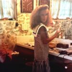 Angela Kinsey Instagram - My Mom had all the 80’s sewing patterns. What was this fashion trend?? Also… my hair! Thanks to my friend, Kerensa, for sending me this picture! I was clearly a fan of this enormous collar romper dress look.