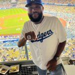 Anthony Anderson Instagram - When you’re home watching the home team! Thank you @sia_collective for making this shoe for me. Thank you @dodgers for winning a championship for me and the city! Let’s do it again! Thank you @mookiebetts for those home runs last night!thank you @joelmchale for nothing, love you brother! LETS GO DODGERS! #justakidfromcompton #huskyandhandsome #bigzaddy #acbarbeque Dodgers Stadium