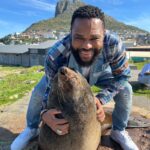 Anthony Anderson Instagram - When you wake up and take an adventure with your brother from another mother @deecamzi It was a great day. I did everything but kiss the seal! We went thru Chapmans peak on the way to cape point. #justakidfromcompton #fromcomptontocapetown #huskyandhandsome #acbarbeque Tamboerskloof, Western Cape, South Africa