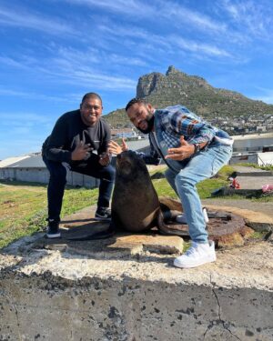 Anthony Anderson Instagram - When you wake up and take an adventure with your brother from another mother @deecamzi It was a great day. I did everything but kiss the seal! We went thru Chapmans peak on the way to cape point. #justakidfromcompton #fromcomptontocapetown #huskyandhandsome #acbarbeque