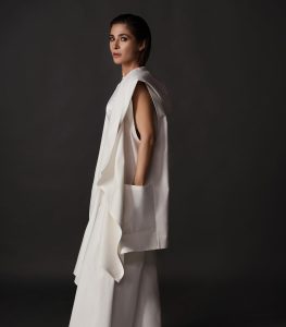 Ayesha Omar Instagram - Activate your Chakras with this all white sustainable look featuring the “Chakra” sleeveless hooded coverup (can be ordered in black also and with sleeves) and the “Hava Havai” pants in white from @ayesha.omar.style.studio “The Style Movement”. All seperates available to shop now! Website goes live at 9 pm tonight but you can start dm-Ing @ayesha.omar.style.studio for immediate orders. 💪🏼💪🏼💪🏼 👀👀 🤍 Hair & Makeup: @irhyanthomas Photography: @iumairbinnisar Skincare: @ayesha.o.beauty Jewelry: @sundustalpur __________ #AyeshaOmar #AyeshaOStyleStudio #SustainableFashion #FashionRevolution #EleganceRedefined #DiscoverYourStyle #AyeshaOmarStyleStudio #AOStyle #TheStyleMovement #allwhite