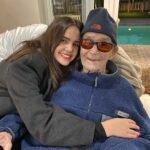 Bailee Madison Instagram - Grandpapa 🤍🤍 Monday October 23rd my grandpapa passed away… a few hours after I landed back in LA after flying to FL where I was able to give him another hug. To say I’m grateful for the moment to see him would be an understatement. Grandpapa was a man full of love and light, who demanded to be loved and to love, who found the joys of family, falling in love, and making memories, the most important. His heart beamed through him always. I will miss him dearly, and as much as I wish he could be by my side through the next big phases of life as I grow older, I do know I will carry him with me and feel him in my heart always. 98 years of life and love. And now, he has returned to my grandma, the love of his life. Raising a glass of wine to you Grandpapa. I love you with all my heart.
