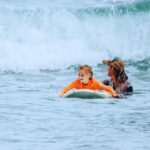 Bethany Hamilton Instagram - RAD moments from my mentorship experience (: I had the incredible chance to hang out with unstoppable girls and their sweet moms during the @ohanaexperiences. After 3 months on zoom having meaningful conversations, the surf day is a cherry on top! We then get to get out in the water with them while they overcome their nerves shred! There are few joys as great as helping to equip and then launch girls into the waves of life — literally and figuratively! These photos say it all… I'm inviting you and your daughter to be the next pair I get to come alongside. Learn more at the Ohana link in my bio. #ohanaexperiences #bhohanaexperiences #motherdaughter #mentorship #surfing #surflessons Hanalei Bay