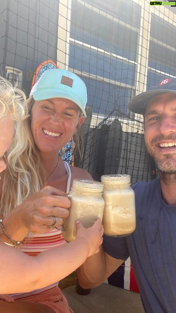 Bethany Hamilton Instagram - Micah trying to sneak a taste of our delicious blended iced coffee 😋 #ad Adam and I enjoy our coffee & this recipe for two definitely hits the spot when it’s hot out! 1/2 cup of frozen coconut 🥛 1 cup of ice 1 cup of chilled toxic free coffee (we did 4 shots of espresso!) 1 packet of Primal Kitchen Collagen Peptides (2 if you want an extra protein boost) 3 Tbsp or so of honey (or maple syrup if you prefer) 1/2 tsp of vanilla 1 pinch of salt Add the ingredients to your blender and blend thoroughly. I hope this fills your craving for a cool summer treat! 😎 @primalkitchenfoods #bethanystylehealth #primalkitchen #biggerbite