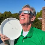 Bill Nye Instagram - Tomorrow, many in North, Central, and South America will have the chance to witness an annular solar eclipse. If the Sun were as big as this disk, the Moon would be as big as this dot. The disk would be 400 x the distance from me to the camera. Don’t forget to wear protective glasses!