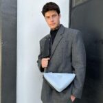 Blake Gray Instagram - Wearing my new #pradatriangle bag everywhere these days. Its convenience and 2-in-1 construction allows me to wear both bags together or separate depending on the occasion. @prada #ad