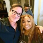 Bob Saget Instagram – Okay… so sometimes you meet a person who you feel kindred to. Comedians can sometimes be like that. Such is my new friendship with @comediennemspat – I’d seen her standup, then watched her new incredibly funny and smart sitcom @betplus – @themspatshow – Then had her on my podcast, and then— fell in love with this hilarious, strong, honest real woman who’s talent and depth also comes out in her new sitcom I feel you should all watch. 
After she and I talked on my podcast, she knew I was going to Indianapolis to do shows this weekend— and then she reached out and invited me to her house for dinner. Tonight, with her family, 
I just had the most genuine fun dinner, with a family that I am told I am “a new family member of.” 
So tonight, I had the pleasure of having dinner at their home. And treated like some traveling Uncle who came by to check in on people he cares about. 
What a gift life can be if you just let it be just that. As hard as these times are, tonight was a gift. And I have a made a new friend. 
This weekend, Ms. Pat will be performing in Pittsburgh while I’ll do my thing in Indianapolis. Two comic ships passing in the night. Damn, I love comedians. And I love Ms. Pat. Catch her on tour. You’ll love her.
