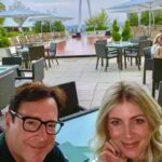 Bob Saget Instagram - First date night in a long time—Been three days— and here I am with my wiff @eattravelrock in St. Louis! Nice to be outside on a rooftop @fsstlouis - And loved my sold out shows this weekend! Thanks to the great audiences. So good to be back here. I’m rooting for St. Louis and all cities I’m traveling to on this tour. Wanna safely let people get together and laugh again. Thank you @explorestlouis @cinderhousestl ! Four Seasons Hotel St. Louis