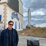 Bob Saget Instagram - Atlantic City. LOVED my two shows @hardrockhcac with @therealmikeyoung - And ironically, it was located right here – where I used to go to as a kid. Steel Pier. It’s hard to believe that when I came here at nine years old, staying every summer at my grandparents, who lived not far inland from this very spot, this pier did not end where it does today. Nor did it look like this. It was amazing. Sure, arcade games, bumper cars, but mainly major showrooms with the biggest acts. It’s now 1000 feet long with some amusement rides but it was 2000 feet long when I used to go to it— And, like I said, it had the biggest names in show business performing. At nine years old I got to see the original Temptations and the original Four Tops on the same bill. My grandparents also took me to see Ricky Nelson there. I got to stand on the side of the pier and watch a helicopter take Ricky Nelson away to his next destination. At the very end of the pier they used to have a diving horse. Thank God they stopped that tradition. But it was also at the end of that pier there was a ballroom where I stood, at 10 years old, next to a drummer who had a small trio— and people were dancing— but the room was pretty empty. That drummer was the legendary Gene Krupa, one of the best drummers who has ever lived. I remember him staring at this kid – me – 10 years old, realizing I was seeing something amazing— watching him play. Memories of what that used to be, years after what was shown on “Boardwalk Empire,” but still remnants of those times existed back then in the 60’s. It was nice to stroll the boardwalk today and see people out, most wearing masks and still enjoying themselves. It felt so good to be here and get to do my first shows in a long time for people who I’m told can’t wait to get out and experience live comedy for the first time here in a long long time. Thanks Hard Rock and thanks Atlantic City. Such wonderful audiences. Hard Rock Hotel & Casino Atlantic City