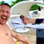 Bob Saget Instagram - Last day in Grand Cayman and the last night of shooting our movie with a wonderful cast, including this handsome devil – @therealravina - Then it’s back to reality – – Masks, second dose of vaccine, and as much stand-up as I can put out there. Will be great to make people laugh again. Grand Cayman, Cayman Islands