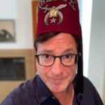 Bob Saget Instagram - Okay, why am I wearing a Fez? Well for the first time ever, since my dad left us for greater pastures, I went through some of his stuff and found some of his treasured accoutrements— He was a very proud Shriner and 32nd degree Mason. For those that know, the Shriners are a society of people who do a lot of philanthropic work and often pay for surgeries for people that don’t have insurance and can’t afford medical care – – For kids and others who’ve needed organs, major super expensive surgeries, and they’ve saved many lives. I just wonder if you have to wear this Fez to do all that. By the way, it is in mint condition. That was my dad, and incredibly kind, smart, and caring man. I wonder if he ever wore this hat.