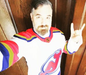 Brian Quinn Instagram - Opened a package to find that my friends at the @njdevils gifted me this funky, sweet Reverse Retro hockey jersey.  I’m going to be wearing this at a game very soon. 

LET’S GO DEVILS! @nhl 

Thank you to @adidashockey for making this one.