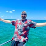 Brian Quinn Instagram - Look at this happy dude! Why is he happy? Because we have a SHARK WEEK special airing this Tuesday on @discovery and @discoveryplus. We had so much fun making this that it’ll come through your screen and infect you. I know that doesn’t sound good but it is. I dive 60 feet down without a cage! #sharkweek #impracticaljokers