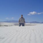 Brian Quinn Instagram - 20 years ago I drove to San Diego from NYC for @comic_con. This is a picture I took in White Sands on the way. I still have that shirt.