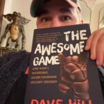 Brian Quinn Instagram - Every time @mrdavehill puts out a book, it’s an immediate read for me. I was supposed to be at his book launch party tonight where I could finally corner the man and tell him how much I love him, but @joederosacomedy messed up the whole plan with his normal nonsense. As I result, I’m spending the night reading The Awesome Game with my pet gremlin. Congrats on the new book, Dave.