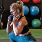 Brooke Ence Instagram - After finding out that I have ANOTHER neck herniation, I’m taking it super easy on the workouts. Here’s a tri-set from the Naked Training Dumbbell Program. Head to my YouTube to watch the full video ❤️ 1a. Alternating DB Forward Lunge - 10/10/8/8 1b. Weighted Cossack Squat - 10/10/8/8 1c. Banded Glute Bridge March - 10/10/8/8 Rest 90 seconds