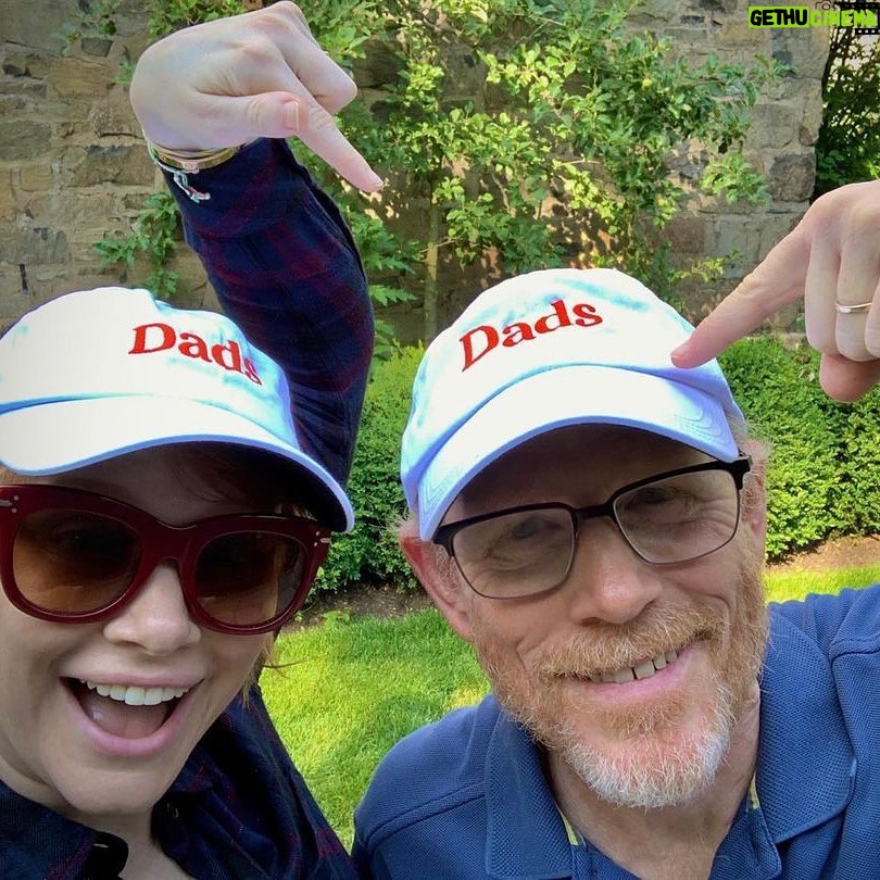 Bryce Dallas Howard Instagram - To my Dad, husband, godfather, godfather of my kids, and to so many others who have parented my kiddos through the years: thank you for your constant presence, your unconditional love, your legitimately funny Dad jokes, and your quiet heroism. I love you all so much.⁣ ⁣ And for those celebrating today, check out #DADS on AppleTV (directed by yours truly) for all the #FathersDay feels ❤️⁣ ⁣ [IDs: Standing in a backyard, BDH and Ron Howard show off their matching “Dads” baseball caps; Seth Gabel makes a silly face after a fresh new haircut; a selfie of Henry Winkler looking cooler as ever with a purple sweater and shades; with a gorgeous sunset behind him at the Grand Canyon, Josh Gad takes a selfie; the poster for "Dads;" a father in silhouette with his hands raised in celebration as his son rides his bike for the first time.]