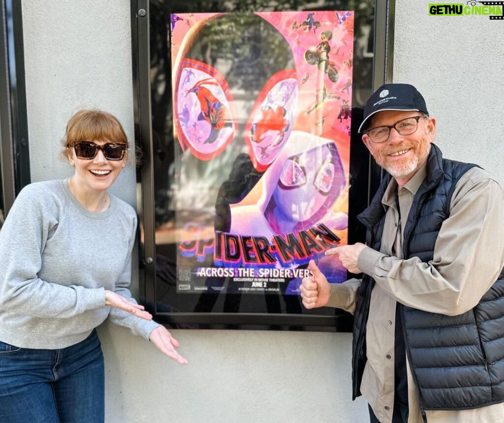 Bryce Dallas Howard Instagram - As a former Gwen Stacy, can I just say: RUN DON’T WALK to see “Spider-Man: Across the Spider-Verse”! Bravo to the entire creative team! An astonishing film on every level. My pops and I are already itching for the next! Congrats:)⁣ ⁣ [ID: After a mind-blowing movie matinee, BDH (left) and Ron Howard (right) stand on either side of a “Spider-Man: Across the Spider-Verse” poster, giving their smiles and two thumbs up.]