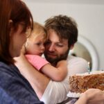 Bryce Dallas Howard Instagram – This beautiful baby girl turns 11 today. She is brilliant and full of joy and I am completely obsessed with her. Love you Bumble ❤️ Happy Birthday⁣
⁣
[ID: BDH holds out a chocolate chip cookie cake for little Beatrice who is wrapped in Seth Gabel’s arms. BDH and Seth smile with all the love in the world at their daughter.]