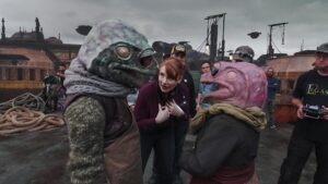 Bryce Dallas Howard Instagram - Reunited. And it feels SO GOOD! It’s an honor to have been invited back to direct on the new season of #TheMandalorian — there’s nothing quite like the adventure, magic, and friendships forged on this show 🥹 Swipe to watch the trailer for season three and mark your calendars for the premiere on March 1, only on #DisneyPlus 💫⁣⁣⁣
⁣⁣⁣
[ID: BDH in various states of glee on the Season 2 set of The Mandalorian: casually hanging out with a Quarren on giant trawler, talking to the iconic Frog Couple on the docks of Trask, and watching the monitor at video village.]