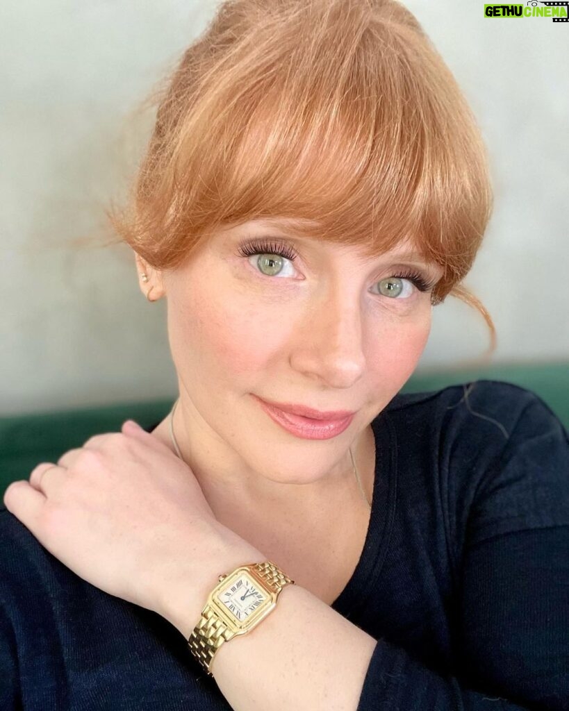 Bryce Dallas Howard Instagram - I wore this beautiful Panthère de Cartier watch all around the world while traveling for Jurassic — and always kept it set to Pacific Time so I knew when to call home 💛 ⁣ ⁣ My adventure with @cartier started 16 years ago with my first short film as a director, “Orchids,” sponsored by Cartier and Glamour Magazine. I distinctly remember trying to keep my cool as I picked the watch for Alfred Molina and necklace and earrings for @katherinewaterston to wear. And since then, to mark significant occasions in my life, my husband has always known to go to Cartier.⁣ ⁣ From supporting my first film all those years ago to lending me this exquisite watch today, thank you @cartier for keeping me present, punctual, and in style. #NotAnAd⁣ ⁣ [ID: BDH in a navy blue sweater poses for a photo, featuring a gold Panthère de Cartier watch on her left wrist.]