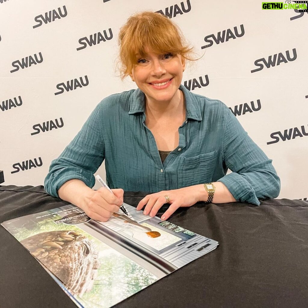 Bryce Dallas Howard Instagram - 8 hours of signatures later 😅 It means the world that fans across the movie multiverses want to memorialize these stories!! Thank you @swau_official for organizing such a fantastic signing day — my inner fangirl had the time of her life⁣ ⁣ and p.s. @missmistyrosas, @chrisfbartlett, @therealbrendanwayne, and @lateefcrowderdossantos: it’s always an honor to put my signature next to yours ❤️⁣ ⁣ [ID: BDH, wearing a linen teal button down blouse, smiles as she signs a Claire Dearing / Jurassic World poster]