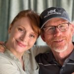 Bryce Dallas Howard Instagram - Happy Labor Day from two proud union members 💪 We are the beneficiaries of incredible advocacy work from @directorsguild, @sagaftra, @wgawest, @producersguild, and @iatse 💛 Thank you unions for keeping us protected (and for the extra day to hang out with my pops!) ⁣ ⁣ [ID: A medium close up photo of BDH and Ron Howard hugging as they smile at the camera. BDH wears a light green linen shirt and her hair in a ponytail. Her dad wears a black polo shirt with white stripes and a black Triple Moon Coffee Co baseball cap]