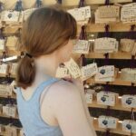 Bryce Dallas Howard Instagram - See you soon Japan, where wishes come true 🥰 #JurassicWorldDominion #NextStop⁣ ⁣ [ID: BDH hangs a tablet on the wishing tree at the Meiji Shrine. Her wish: “I pray that I and my family and friends hear, and listen for, and act upon the wisdom, divine wisdom, that is guiding us in every moment toward self love, inner peace, and our potential and mission on this planet. I wish to always feel gratitude.”]