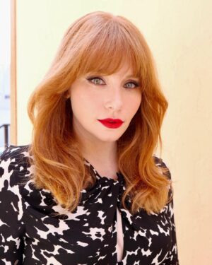 Bryce Dallas Howard Instagram - 💋💋💋⁣
⁣⁣
Makeup: Kate Synnott (@katesynnottmakeup)⁣ ⁣
Hair: Bobby Eliot (@bobbyeliot)⁣⁣
Dress: @altuzarra⁣
Shoes: @ysl ⁣
📸: Bobby Eliot⁣
⁣
[ID: Taking advantage of the sunny day outside, BDH poses in a flowy, black and white tortoise-print midi dress. She pairs the outfit with tall black heels and her favorite shade of red lipstick]
