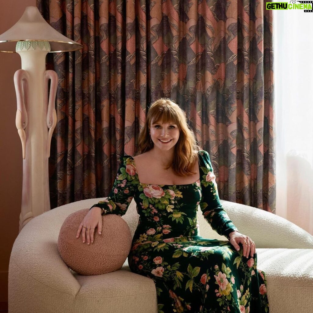 Bryce Dallas Howard Instagram - There are two things I need you to know about my home: (1) this is where the magic happens 😉 and (2) the design is a love affair between every franchise I treasure and have worked in. ⁣ ⁣ I am so so grateful to the exceptionally creative @clairethomas for designing our new home and bringing her love and expertise of production design to every inch of the space — the colors, textures, prints, good vibes, everything! My family and I are living in a retro-futurist dream come true and it’s thanks to Claire and her incredible vision and team 💖💛⁣ ⁣ You can take a full @archdigest tour of this fangirl’s paradise at the link in bio 🏠⁣ ⁣ Photographer: @timhirschmann⁣ Interior Styling: @emilyvallely⁣ Interior design: @clairethomas⁣ Writer: @lauramaytodd⁣ ⁣ [ID 1: BDH lounges on her pink, cloud-like chaise from @luluandgeorgia next to her favorite vintage flamingo lamp. It’s a redhead oasis ✨]⁣ ⁣ [ID 3: BDH leans on the shoulder of @stealthgabel in their Miyazaki dining room, the @schumacher1889 forest wallpaper reminding them of “My Neighbor Totoro”]⁣ ⁣ [ID 4: BDH and glowing designer @clairethomas stand in the home’s kitchen. The morning light highlights the pinkish hue of the Antelope Canyon @fireclaytile and @portolapaints Sparks limewash wall paint]