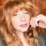 Bryce Dallas Howard Instagram - My response when people ask how I’m liking my new makeup vanity 💕⁣ ⁣ Check out my reels to see how this look came to be 👀⁣ ⁣ [ID: A glam selfie of Bryce looking into camera with her left hand to her face]