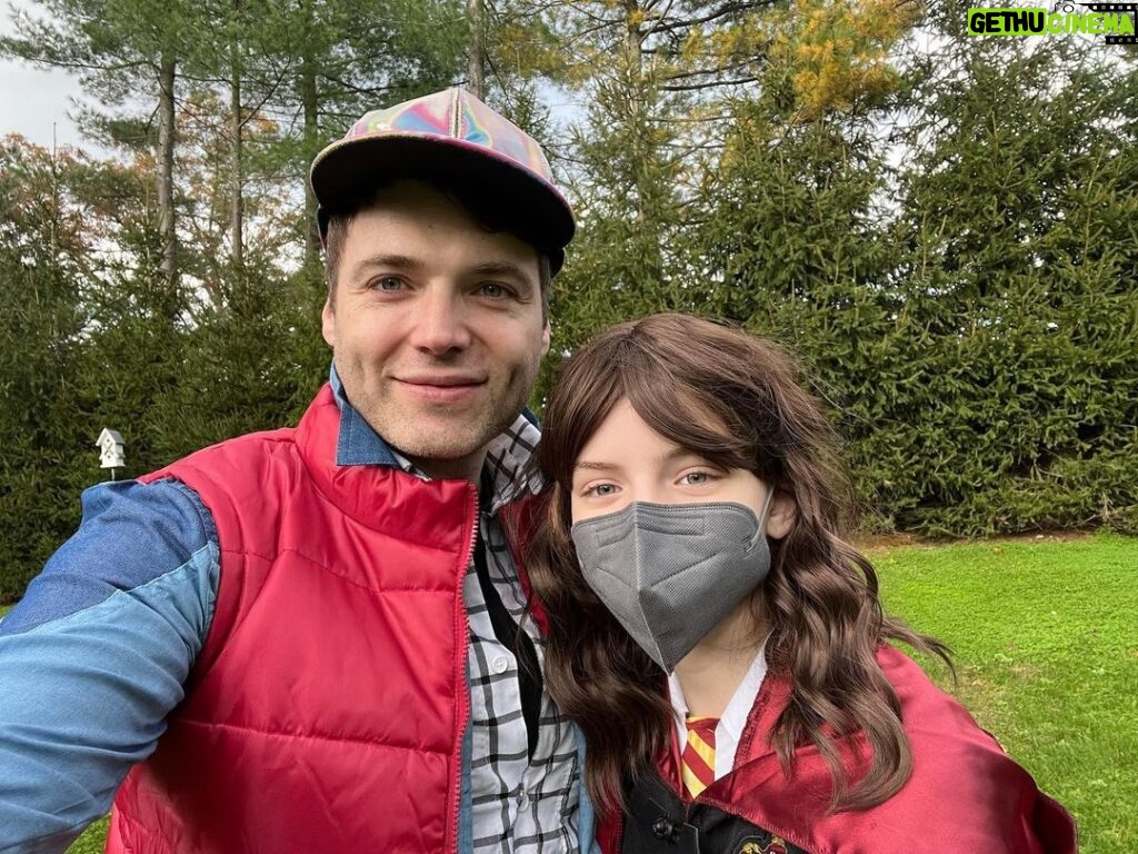 Bryce Dallas Howard Instagram - Happy Halloween from Hermione and Marty!⁣ ⁣ [ID: A selfie of Seth dressed as Marty Jr. from “Back to the Future” in a red puffer vest and blue shirt underneath and my daughter dressed as Hermione from “Harry Potter” in a black shirt and Gryffindor red cape]