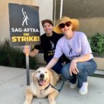 Bryce Dallas Howard Instagram – Proud to rep @sagaftra on this National Day of Solidarity!! Today, across the country and across industries, we’re coming together to show that our movements for better compensation, safer working conditions, and fair contracts will not be beat! Our community is stronger than ever and we have hot labor summer to prove it 🔥🔥

[ID: Seth Gabel (left) and BDH (right) proudly wear their SAG-AFTRA shirts on the picket line. They crouch next to their golden retriever Story who visited them on the picket line for a morale boost.** Seth holds a “SAG-AFTRA on Strike!” sign while BDH pets Story. All three are smiling big in solidarity with the actors.]

** It’s important to mention that because of the heat, I don’t recommend bringing pets to the picket line. Story’s visit was a special arrangement where she stayed less than 5 minutes, and in any other scenario she wouldn’t be there. Please take care of yourself and your fur babies in the heat!

#SagAftraStrong #Power2Performers #WGAStrong