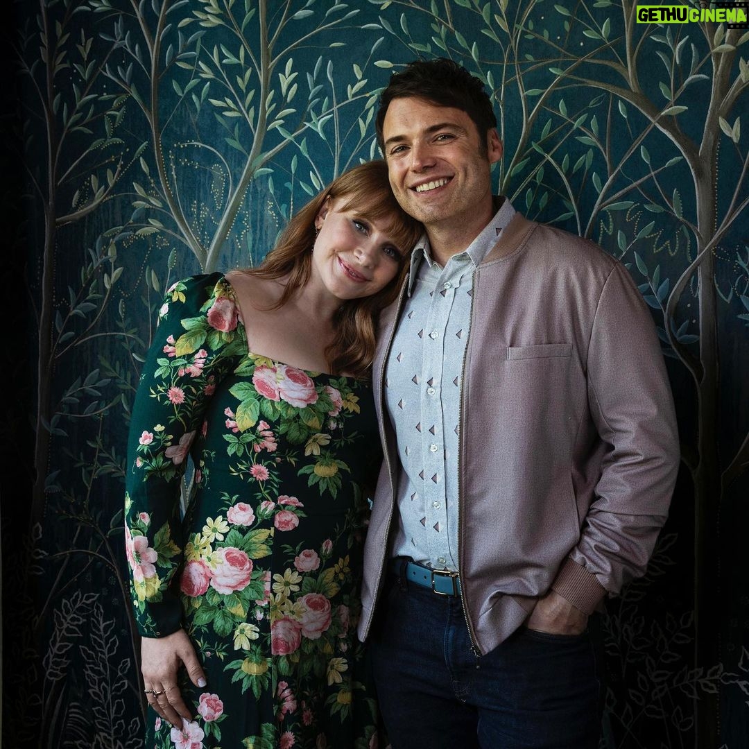 Bryce Dallas Howard Instagram - There are two things I need you to know about my home: (1) this is where the magic happens 😉 and (2) the design is a love affair between every franchise I treasure and have worked in. ⁣ ⁣ I am so so grateful to the exceptionally creative @clairethomas for designing our new home and bringing her love and expertise of production design to every inch of the space — the colors, textures, prints, good vibes, everything! My family and I are living in a retro-futurist dream come true and it’s thanks to Claire and her incredible vision and team 💖💛⁣ ⁣ You can take a full @archdigest tour of this fangirl’s paradise at the link in bio 🏠⁣ ⁣ Photographer: @timhirschmann⁣ Interior Styling: @emilyvallely⁣ Interior design: @clairethomas⁣ Writer: @lauramaytodd⁣ ⁣ [ID 1: BDH lounges on her pink, cloud-like chaise from @luluandgeorgia next to her favorite vintage flamingo lamp. It’s a redhead oasis ✨]⁣ ⁣ [ID 3: BDH leans on the shoulder of @stealthgabel in their Miyazaki dining room, the @schumacher1889 forest wallpaper reminding them of “My Neighbor Totoro”]⁣ ⁣ [ID 4: BDH and glowing designer @clairethomas stand in the home’s kitchen. The morning light highlights the pinkish hue of the Antelope Canyon @fireclaytile and @portolapaints Sparks limewash wall paint]