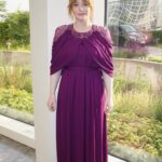 Bryce Dallas Howard Instagram - Dinosaurs, but make it fashion 🦖 Thank you Germany for being an incredible last stop on this leg of our international travels!! Next stop, home sweet home: Los Angeles! #JurassicWorldDominion ⁣ ⁣ Makeup: Kara Bua (@karayoshimotobua) ⁣⁣⁣⁣⁣ London/ Germany Hair: Christian Wood (@cwoodhair)⁣⁣⁣ Manicure: Ariane Brimah⁣ And special thanks to @alex.schack✨⁣ ⁣ [ID 1 & 2: BDH signs autographs, wearing a plum floor-length Pamella Roland gown with fancy silver beading along the neckline and sleeves.]⁣ ⁣ [ID 3: In front of a dinosaur installation in Trafalgar Square, BDH wears a bright tennis-ball yellow Alex Perry dress with an angular silhouette and neck cutout]⁣ ⁣ [ID 4 & 5: Rexy and BDH roar in Germany; BDH wears a midi red Valentino dress with matching red pumps that made her very tall]⁣ ⁣ [ID 6: Izzy Sermon, BDH, and Laura Dern speak at the London crew screening of Jurassic World Dominion. BDH wears a caramel-hued Self Portrait mesh midi dress and black blazer. She’s emotional saying thank you to all the people]