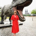 Bryce Dallas Howard Instagram - Dinosaurs, but make it fashion 🦖 Thank you Germany for being an incredible last stop on this leg of our international travels!! Next stop, home sweet home: Los Angeles! #JurassicWorldDominion ⁣ ⁣ Makeup: Kara Bua (@karayoshimotobua) ⁣⁣⁣⁣⁣ London/ Germany Hair: Christian Wood (@cwoodhair)⁣⁣⁣ Manicure: Ariane Brimah⁣ And special thanks to @alex.schack✨⁣ ⁣ [ID 1 & 2: BDH signs autographs, wearing a plum floor-length Pamella Roland gown with fancy silver beading along the neckline and sleeves.]⁣ ⁣ [ID 3: In front of a dinosaur installation in Trafalgar Square, BDH wears a bright tennis-ball yellow Alex Perry dress with an angular silhouette and neck cutout]⁣ ⁣ [ID 4 & 5: Rexy and BDH roar in Germany; BDH wears a midi red Valentino dress with matching red pumps that made her very tall]⁣ ⁣ [ID 6: Izzy Sermon, BDH, and Laura Dern speak at the London crew screening of Jurassic World Dominion. BDH wears a caramel-hued Self Portrait mesh midi dress and black blazer. She’s emotional saying thank you to all the people]